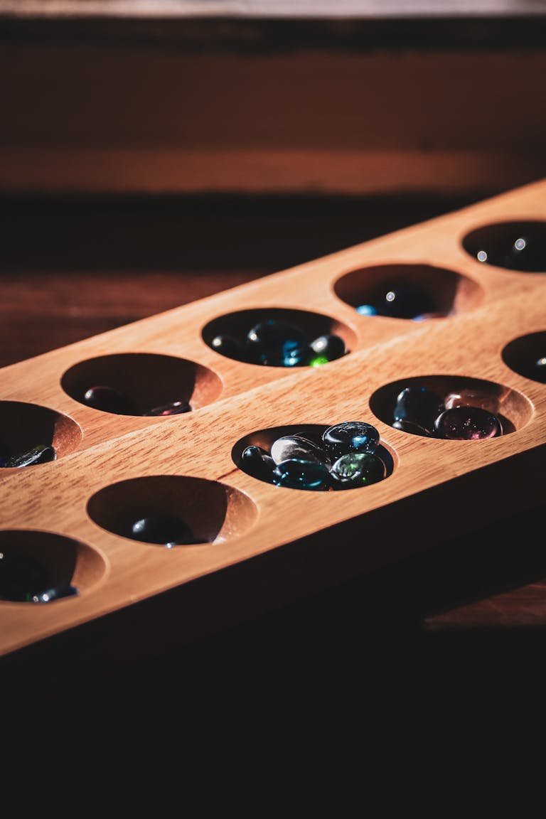 Wooden Mancala in Close Up Shot