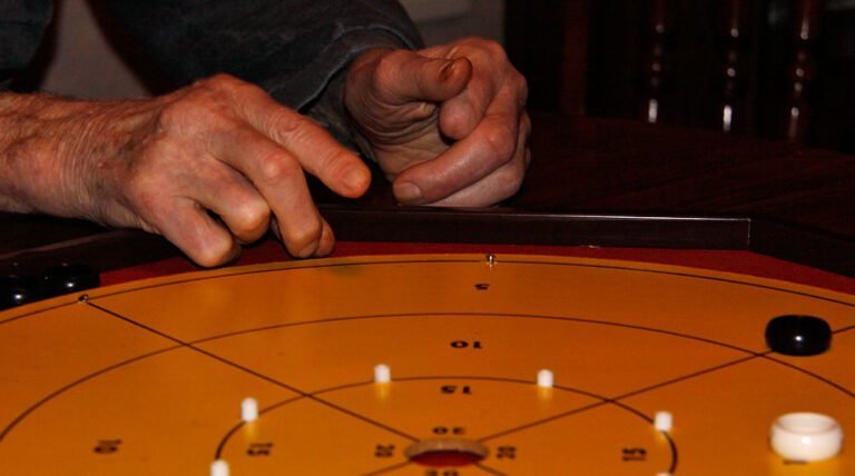 A man playing Crokinole