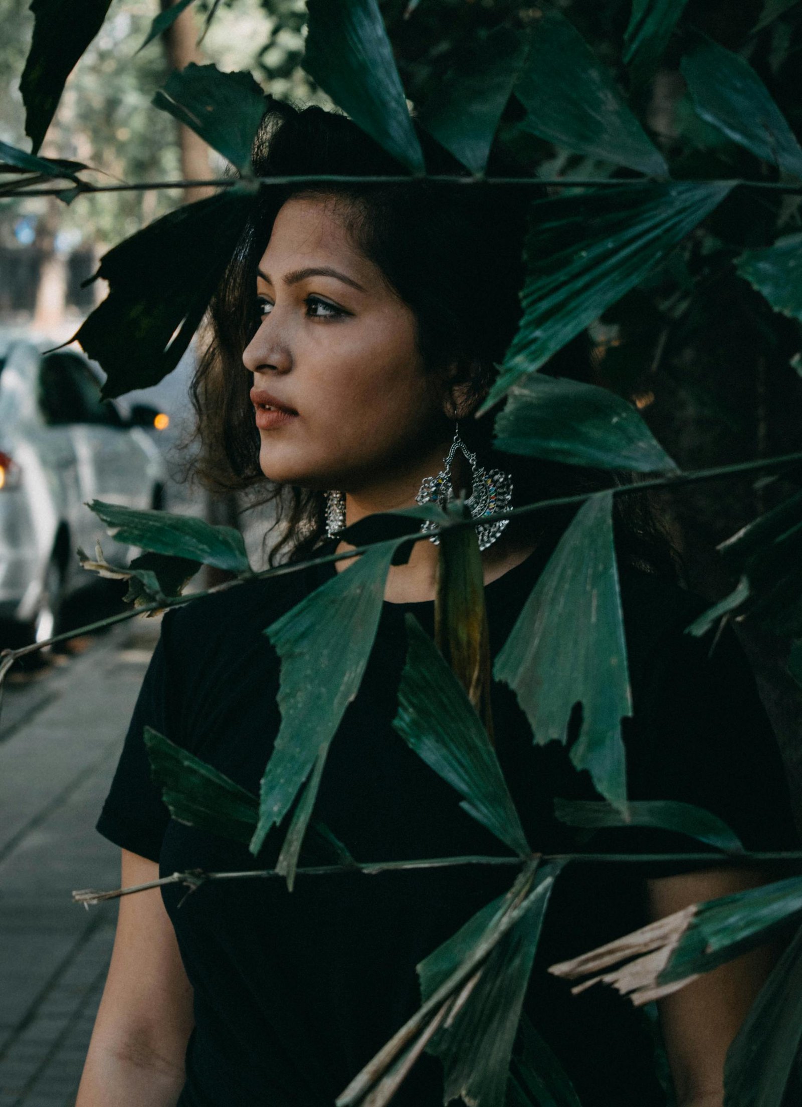 A woman standing in front of a tree